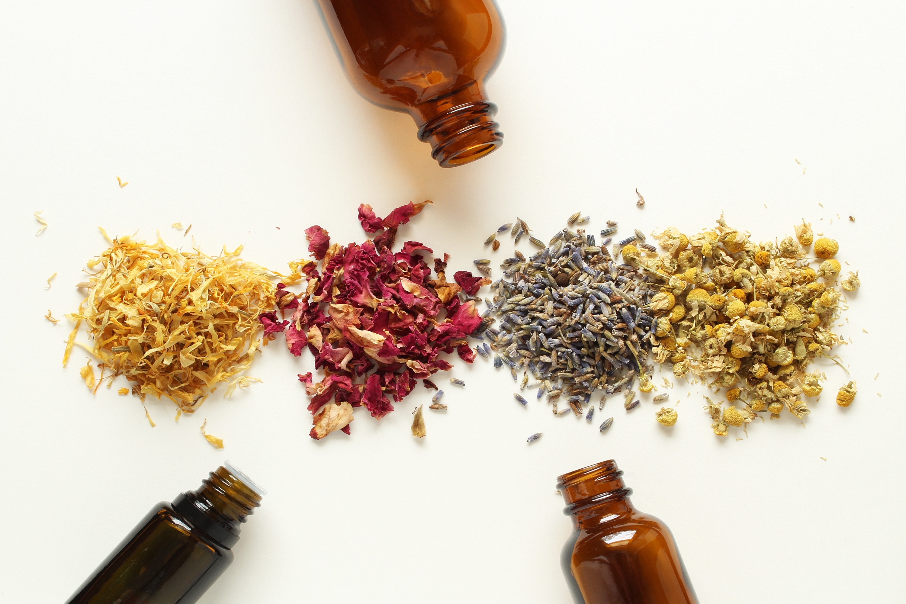 Aromatherapy bottles and dried herbs